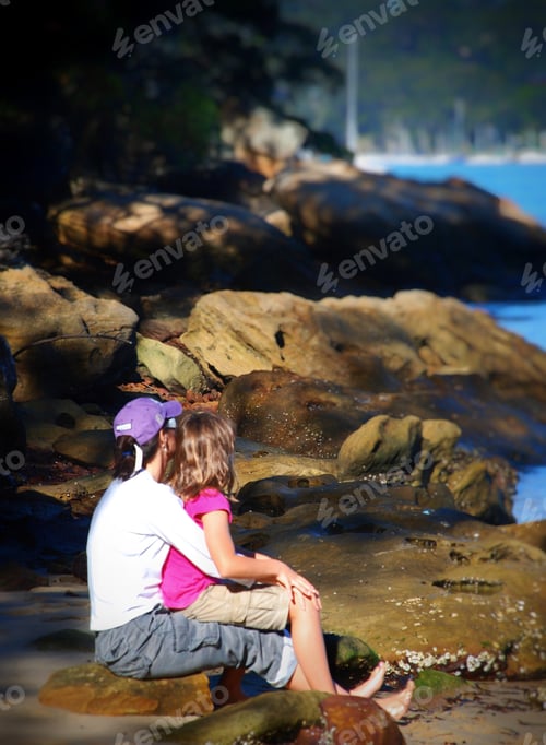 Preview: Mother with her daughter admiring the water and enjoying quiet time