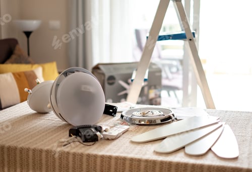 Preview: Accessories on the table ready to be assembled to install a paddle fan on the ceiling