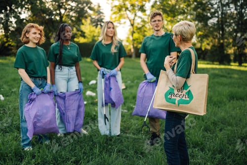 Preview: Group of volunteers collecting garbage in park