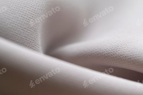 Preview: abstract texture of draped beige background. eautiful textile backdrop. Close-up.