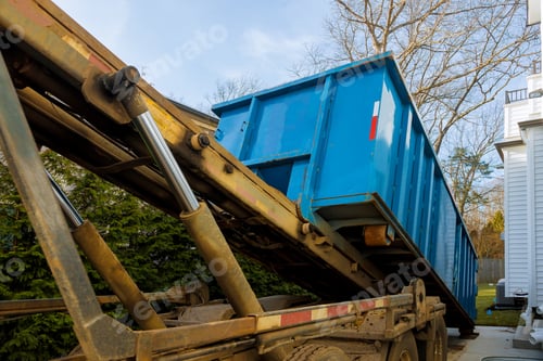 Preview: Unloading empty dumpster