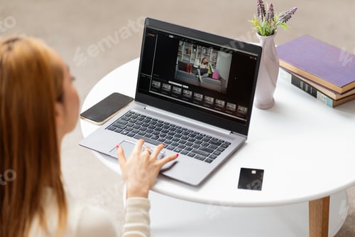 Preview: Woman Using Laptop At Home Office
