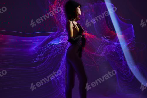 Preview: Positive young woman neon lines posing model glamor color background unaltered