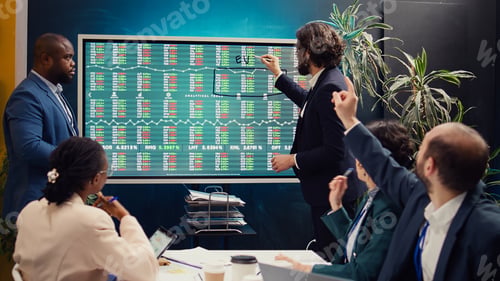 Preview: Sales management team reviewing global stock market trends