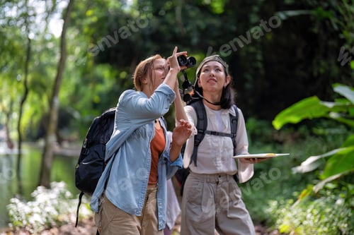Preview: Backpack tourist travel outdoor adventure bird study using binoculars looking and record to book