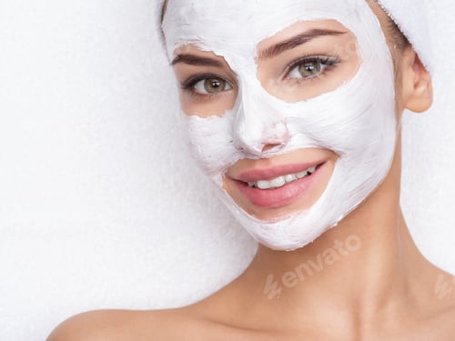 Preview: smiling woman in spa salon with cosmetic mask on face