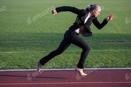 Preview: Business Woman In Start Position Ready To Run And Sprint On Athletics Racing Track