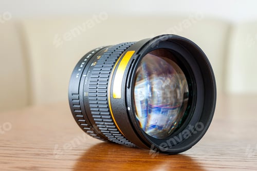 Preview: Camera portrait fix focus photo lens on dark wooden background