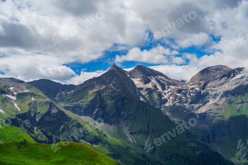 Preview: Majestic Alpine Mountains in Kaprun, Austria with Green Hills and Snow-Capped Peaks