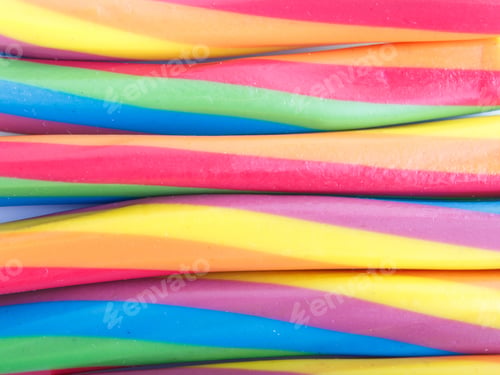Preview: rainbow chewing caramel sugar candies. colored decoration background