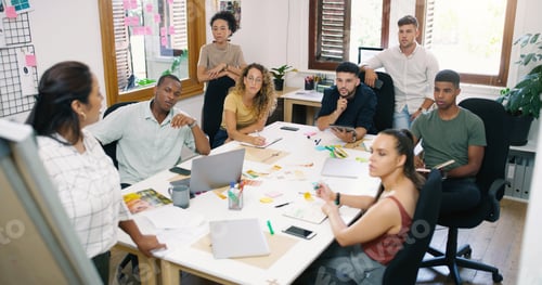 Preview: Shot of a young businesswoman having a brainstorming session with her colleagues in a modern office