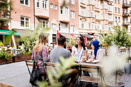 Preview: Group of people sitting at outdoor cafe table