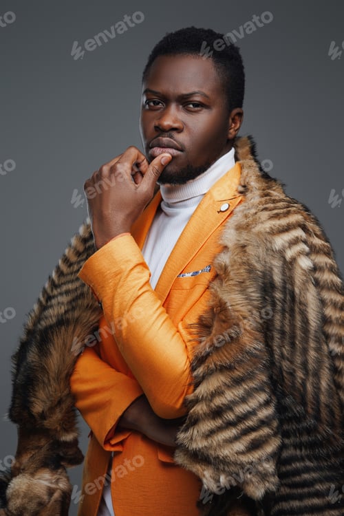 Preview: Cool african man with fur against gray background