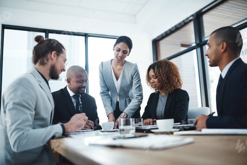 Professionals Collaborate During Meeting in Modern Office
