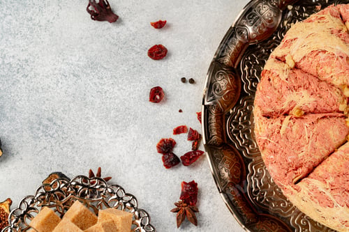 Preview: Turkish pastries and scattered dry fruits on table