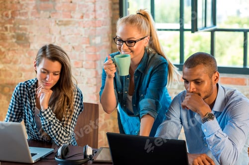 Preview: Young business people in office preparing foundation of a start-up company