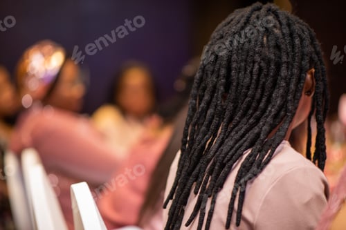 Preview: Woman with dreadlocks hairstyle shot from behind