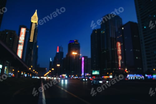 Preview: Urban view on night Dubai city highway with cars and street lamps blurred light