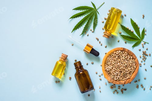 Preview: Cannabis oil and cannabis seeds at white