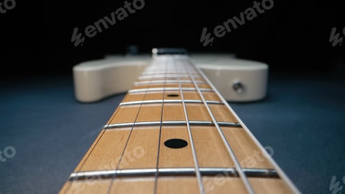Preview: Macro of strings on electric guitar fretboard. Details of instrument close-up
