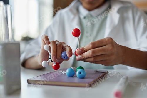 Preview: Unrecognizable Boy Assembling Chemical Structure Model