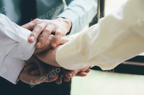 Preview: business team put hand together , collaboration and teamwork concept