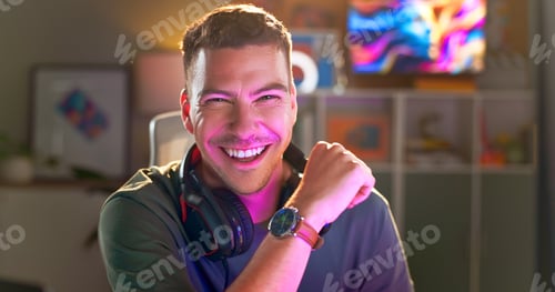 Preview: Happy man, portrait and gamer with headphones at night for esport, online tournament or streaming a