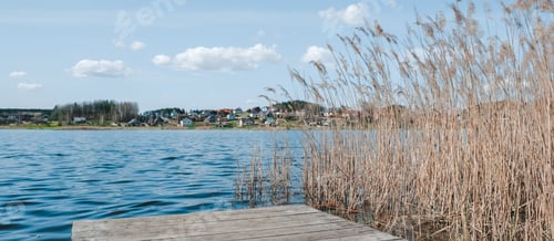 Preview: travel,adventure,Rest on the lake. A young girl traveler is resting near the water. Eco travel