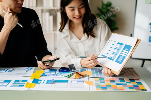Preview: UX developer and ui designer brainstorming about mobile app interface wireframe design