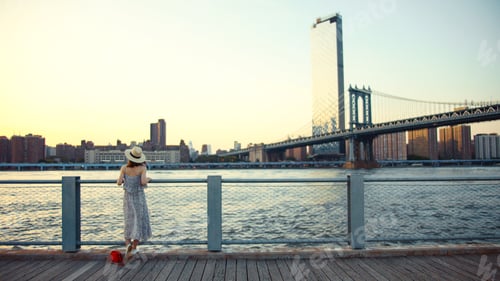 Preview: Young woman on the embankment in summer
