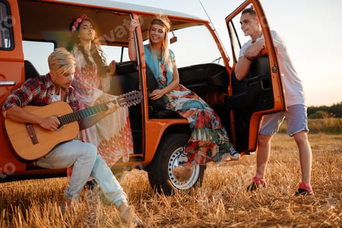 Preview: Hippie friends with guitar on a road trip