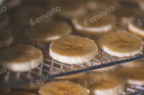 Preview: Banana chips drying inside a food dehydrator machine