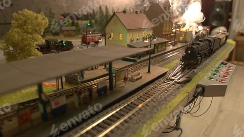 Preview: Model of a train moves down the miniature railroad.
