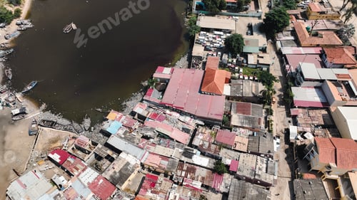 Preview: Top down view of informal settlements in Luanda, Angola with river and housing structures