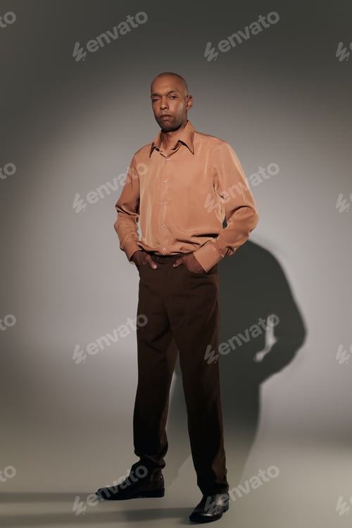 Preview: real people, bold african american man with myasthenia gravis standing with hands in pockets