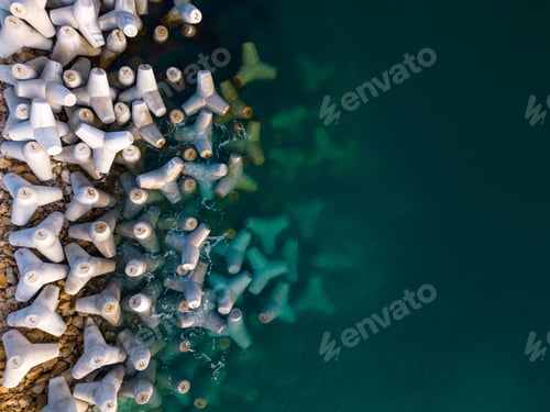 Preview: Aerial drone view of a breakwater. breakwater in the sea, a collection of concrete tetrapod breakers