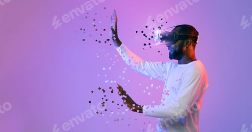 Preview: Black man in VR headset touching something invisible, copy space
