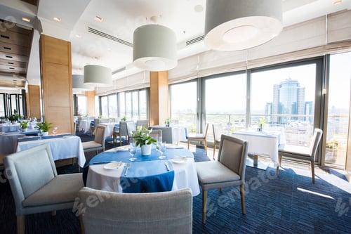 Preview: interior of empty big luxury restaurant with beautiful view from windows