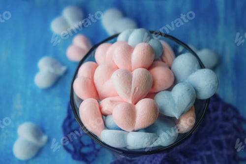 Preview: pink and blue meringue hearts on painted purple background, tasty love, Valentines Day