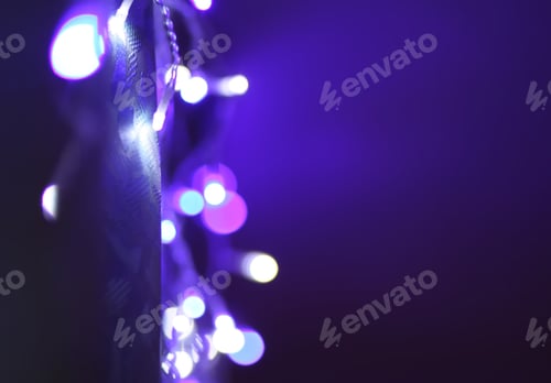 Preview: Abstract bokeh background. Blurred garland lights.