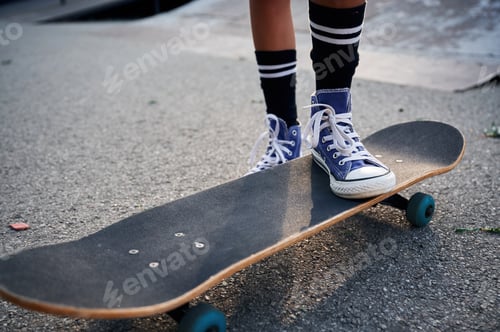 Preview: Close up view of skateboard riding by a young girl