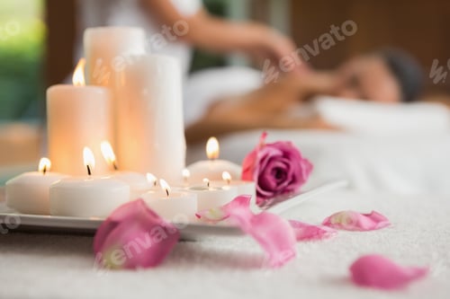 Preview: Candles and rose petals on massage table at the health spa