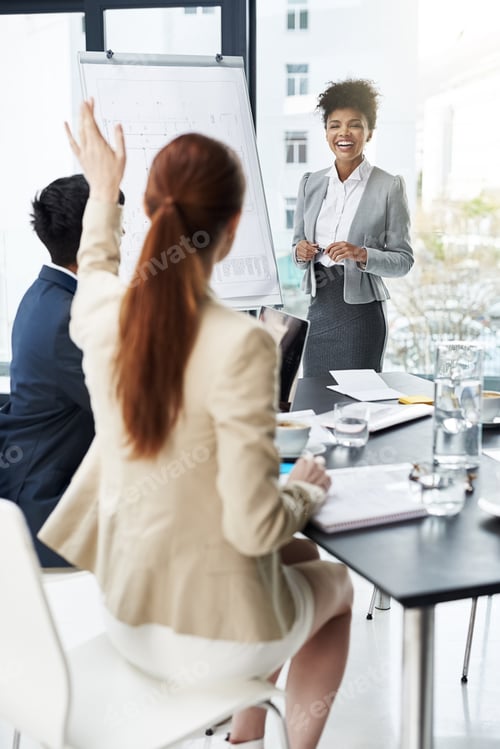 Preview: Shot of a group of businesspeople attending a presentation
