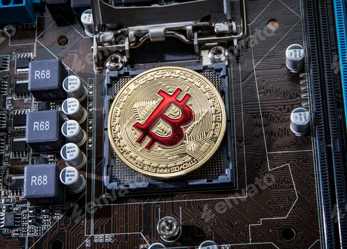 Preview: Gold Bit Coin BTC coins on the motherboard. Bitcoin is a worldwi
