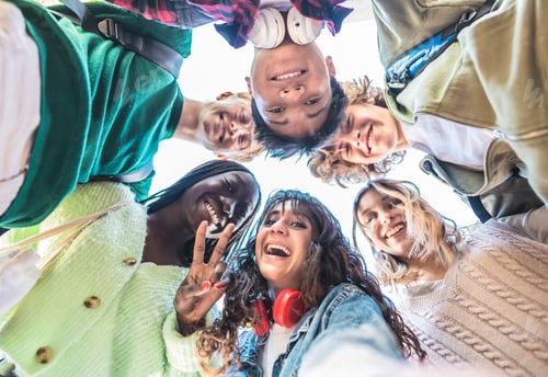 Preview: Multiracial group of students taking selfie picture after school
