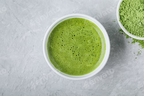 Preview: Japanese matcha green tea latte in white bowl on gray background