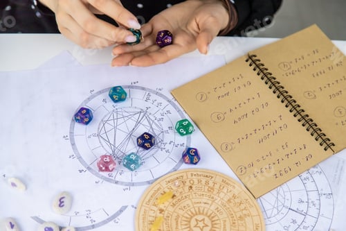 Preview: Woman numerologist astrologer counts numbers. Selective focus.