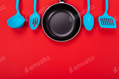 Preview: Kitchen utensils for cooking in kitchen isolated with copyspace on red background