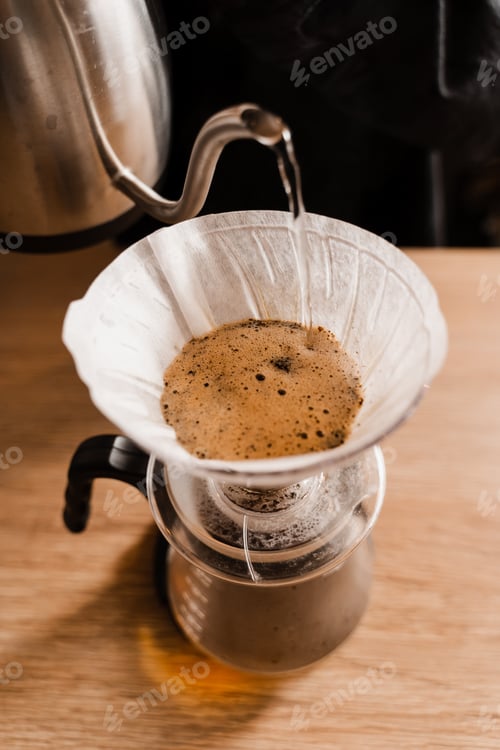 Preview: Pour over filter method brewing coffee at cafe or home