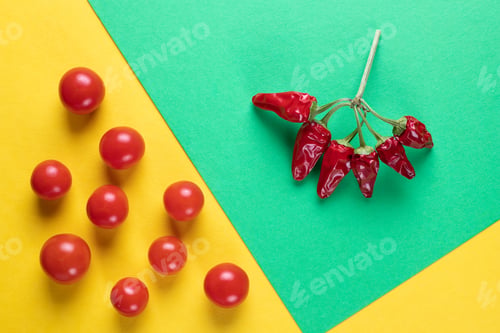 Preview: Creative of colored tomatoes and hot pepper, Creative foods. Green and yellow background for design
